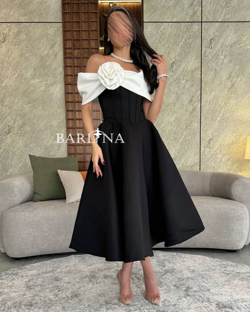 Black corset dress with white flower