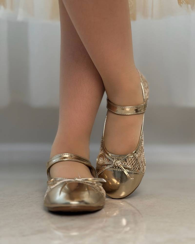 Girls' shoes with a front strap and a lace-up detail