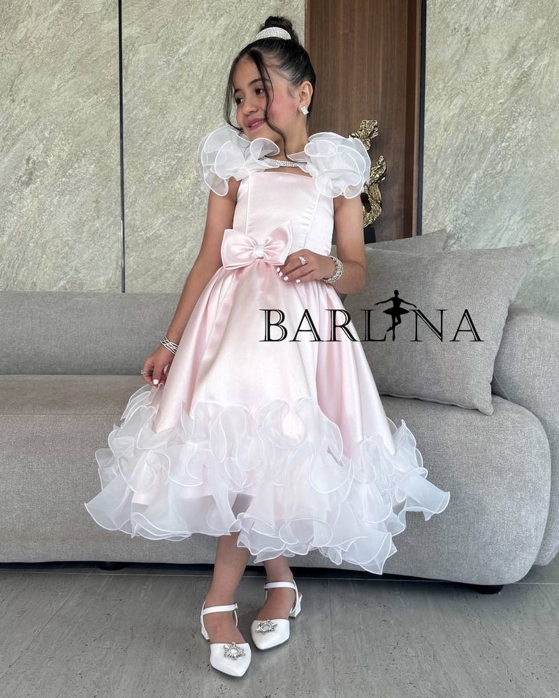 Girls' pink dress with elegant bow and ruffles