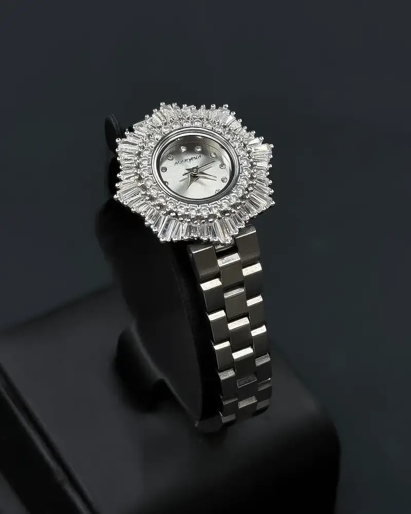 Elegant women's watch with a round studded bezel