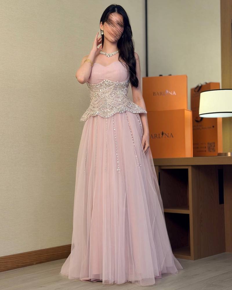 Nude tulle evening dress with a beaded corset