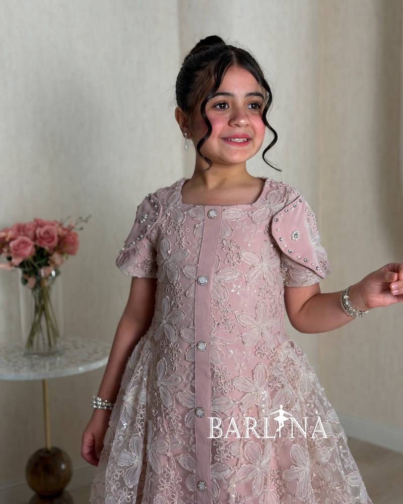 Pink girls' dress with a sheer overlay decorated with roses
