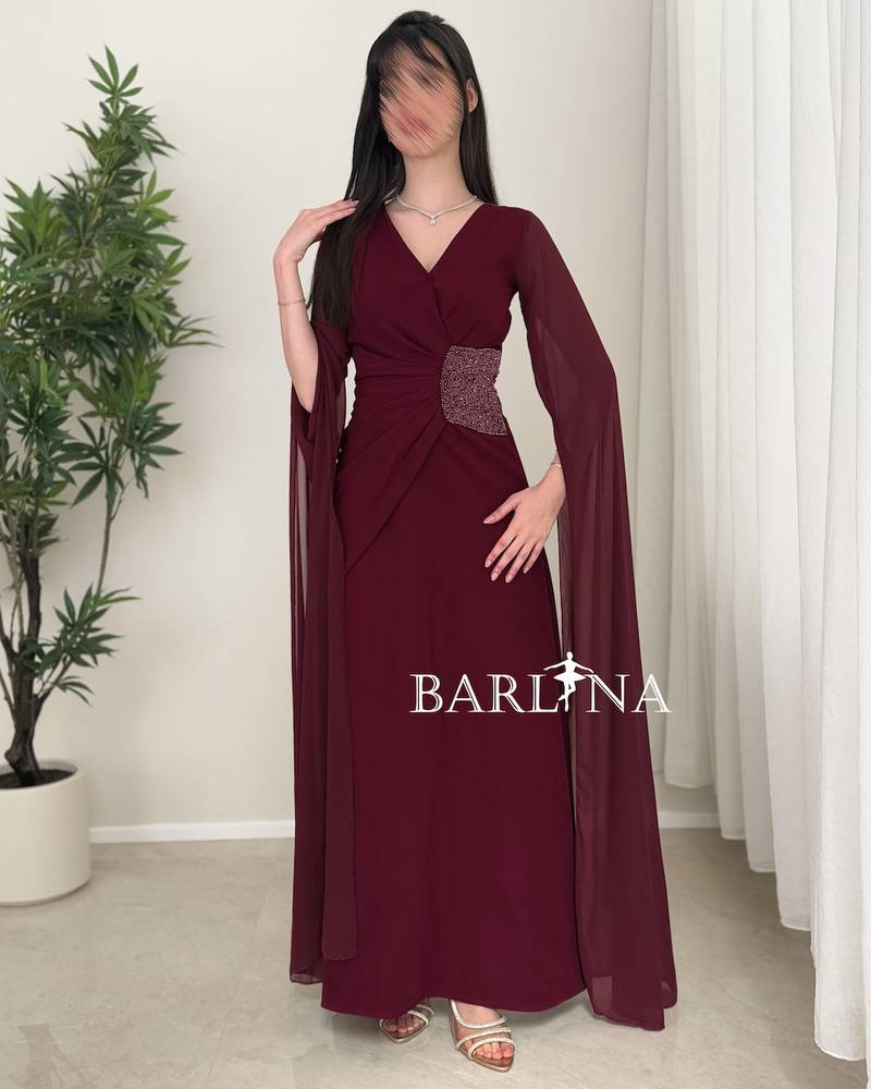 A soft burgundy dress with side embroidery details