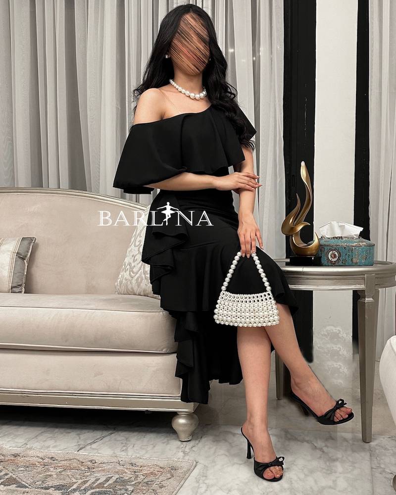 Black midi dress with side ruffle design