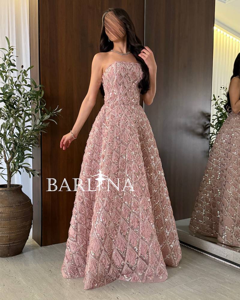 Pink evening dress with shiny embroidery and a geometric pattern
