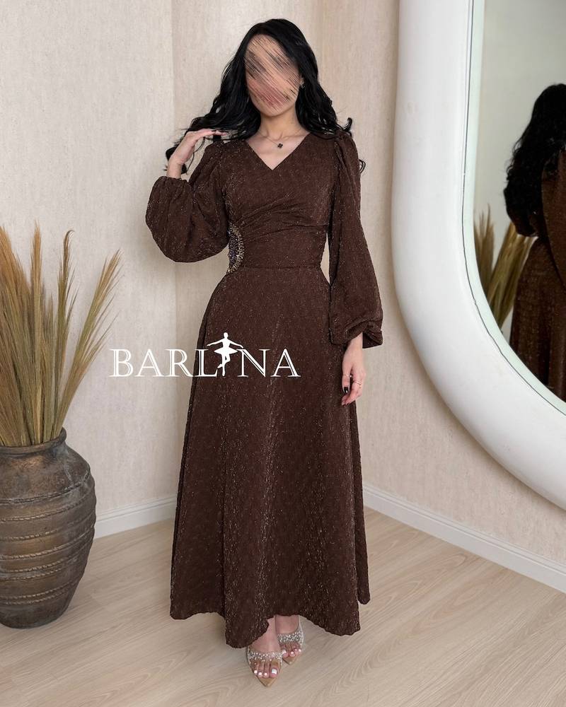 Soft brown dress with long puffed sleeves