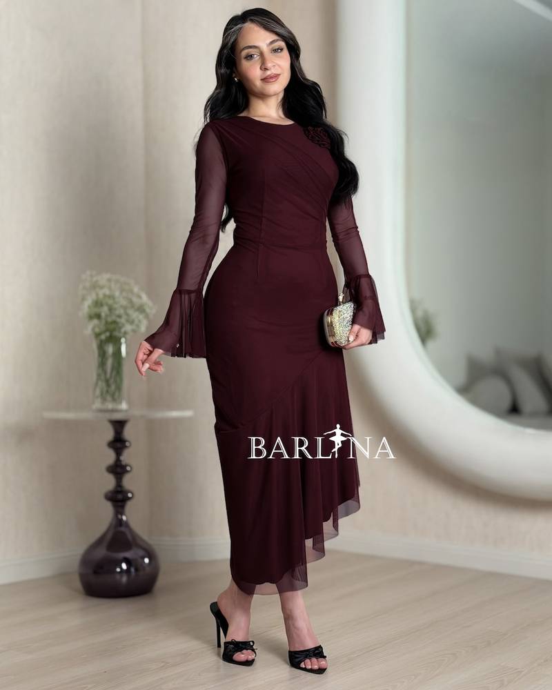 Burgundy dress with an asymmetrical cut