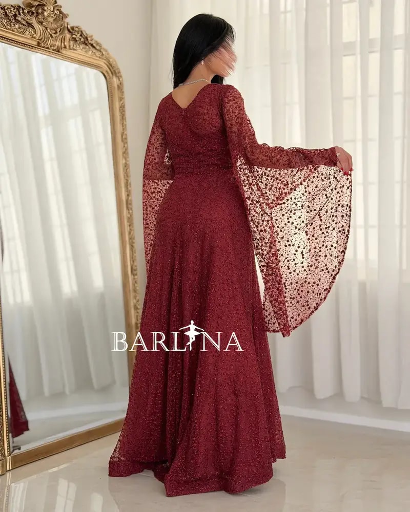 Red evening dress adorned with shimmering embroidery