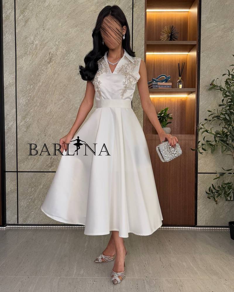 Elegant white dress with classic collar