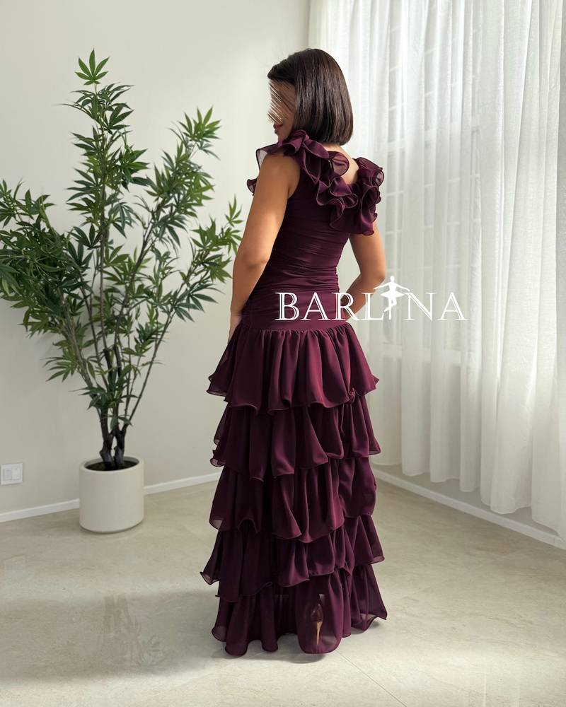 Burgundy dress with a ruffled collar and tiered layers