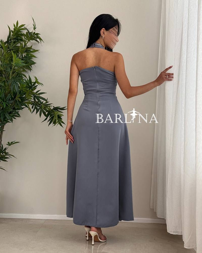grey halter dress adorned with crystal beads