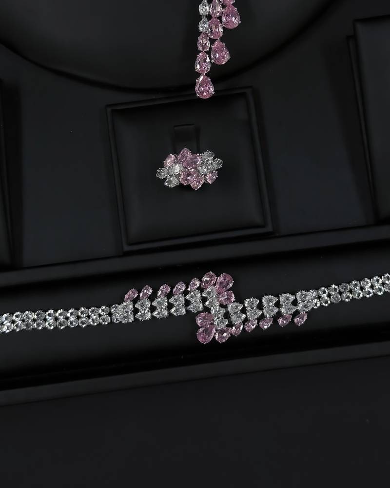 Modern accessory set with an open purple necklace