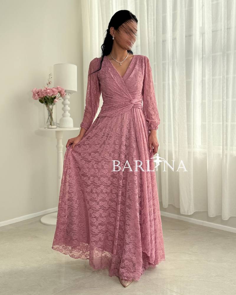 Pink lace dress with a crisscross wrap design
