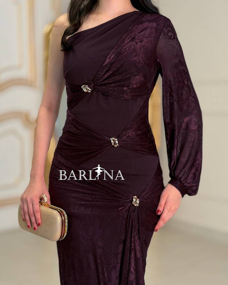 A soft, fitted dress adorned with elegant metallic details.