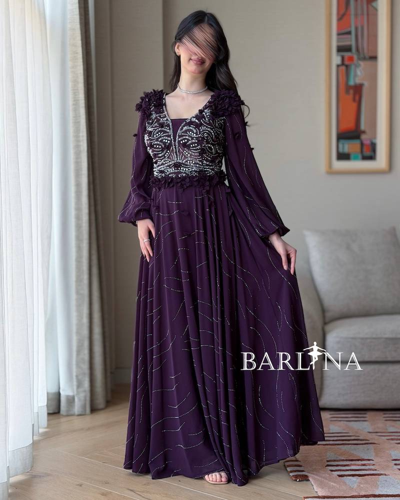 A purple flared dress embroidered with silver beads
