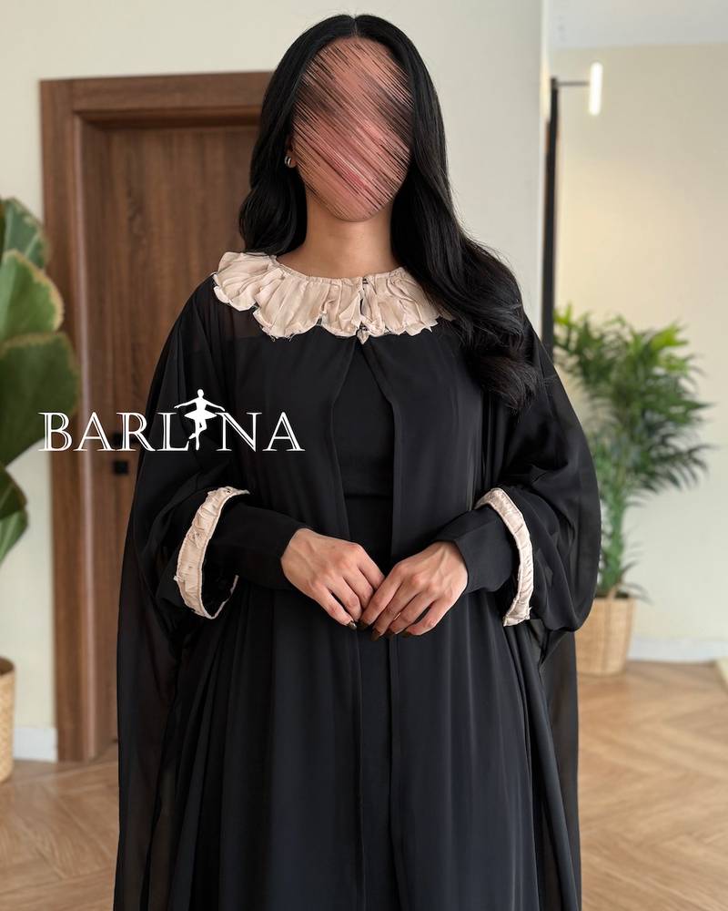 Soft black dress with a floral abaya