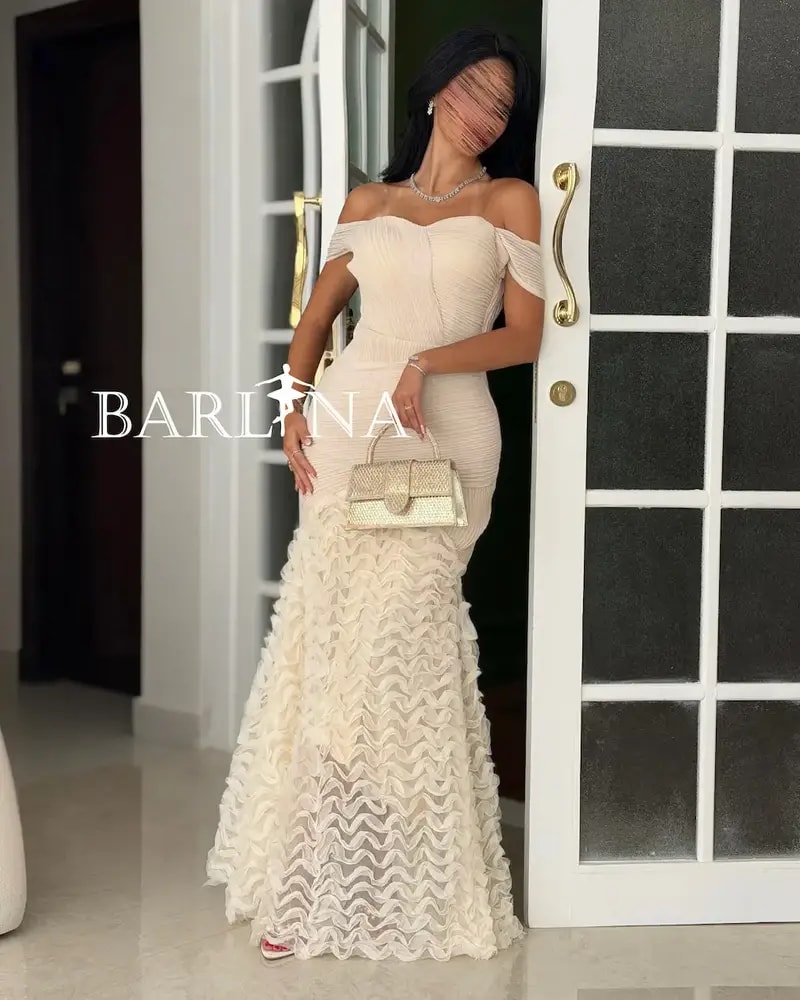 Creamy off-the-shoulder dress with ruffle details