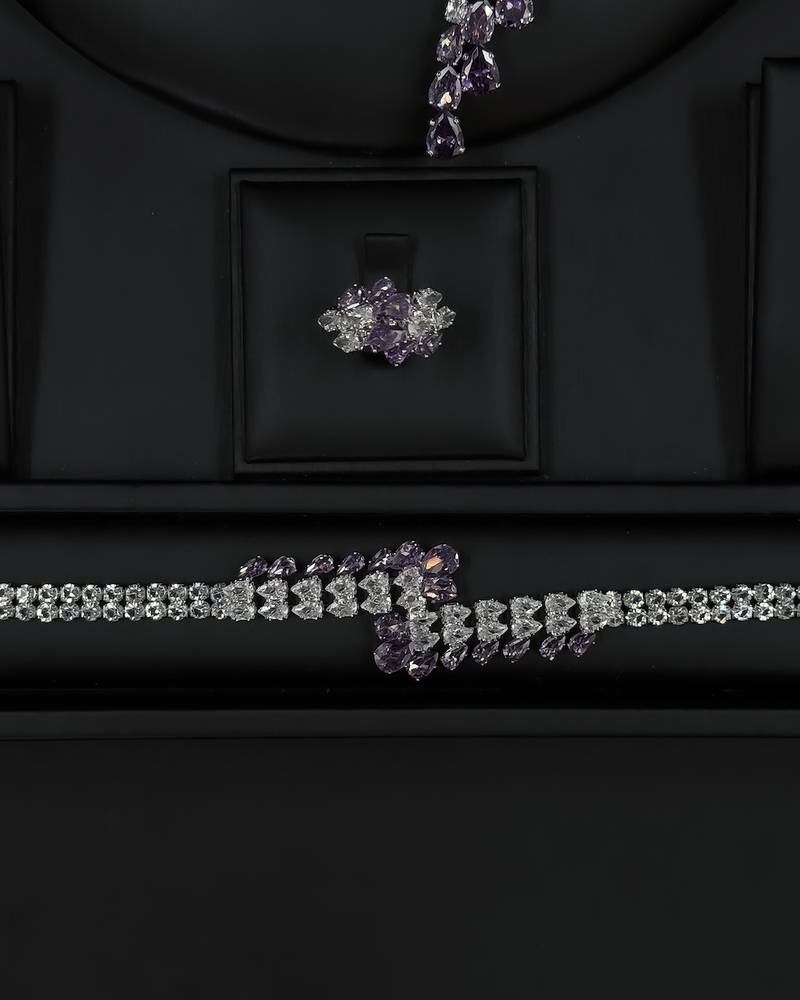 Modern accessory set with an open purple necklace