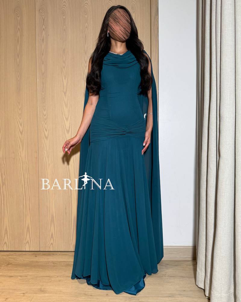 Petrol dress with a draped back cape