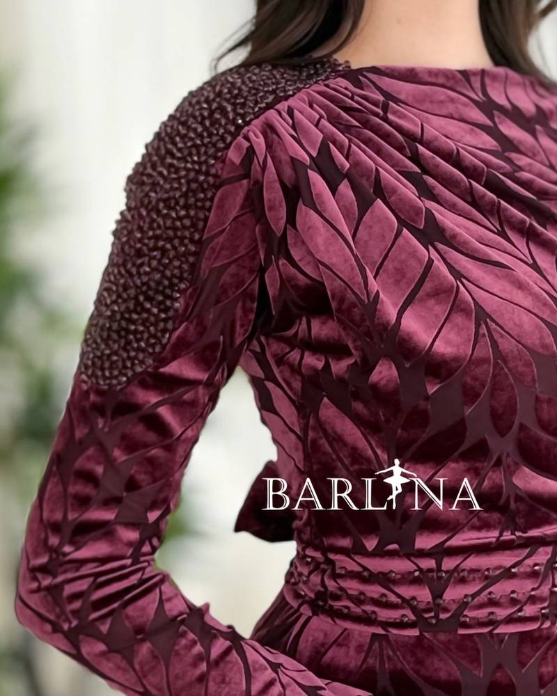Burgundy dress with one shoulder adorned with crystal beads