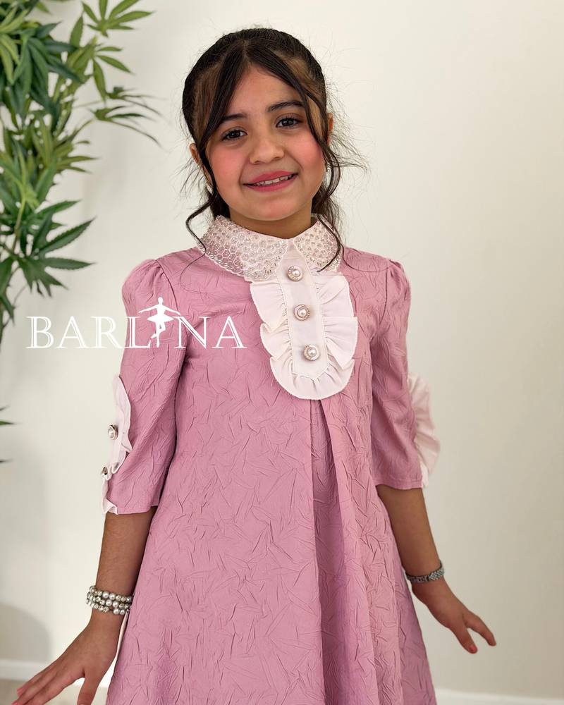 A soft, girly dress adorned with lace details.