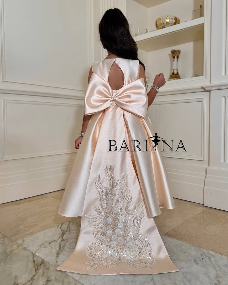 Girls' dress with a long train and an open back