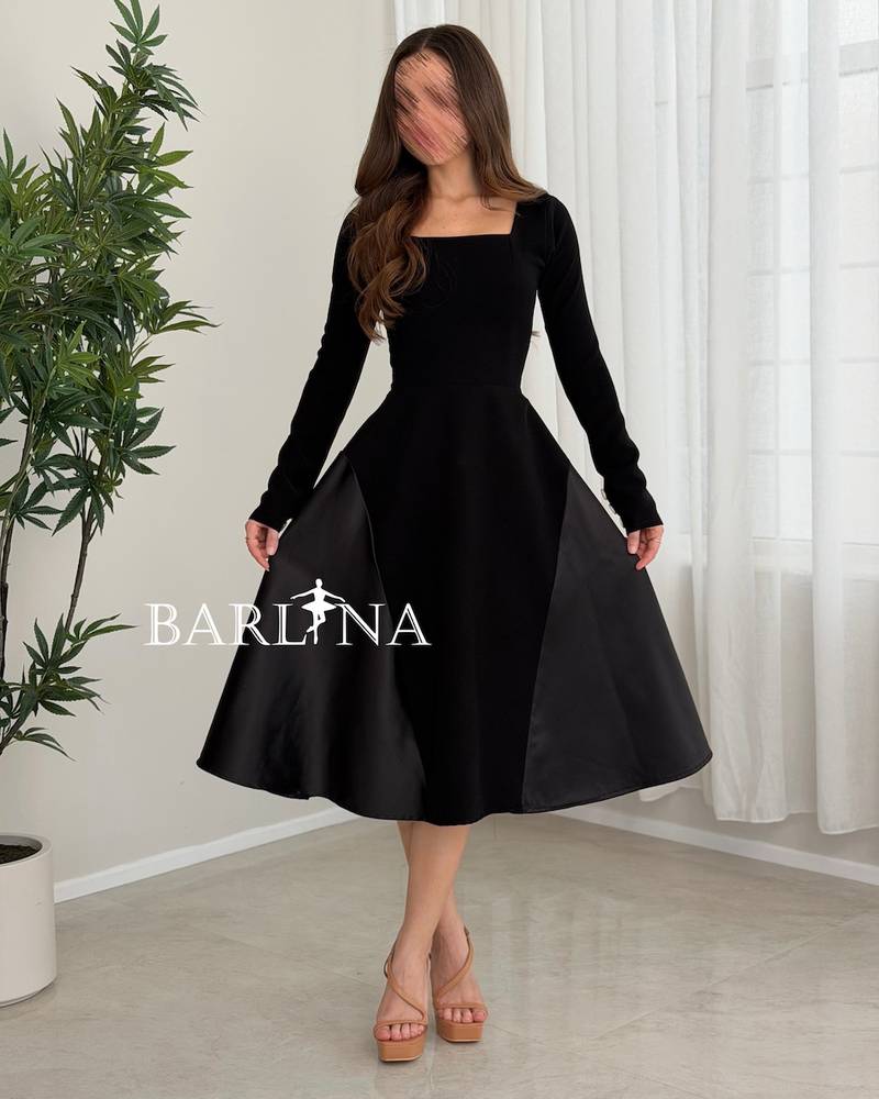 A simple black midi dress with a square neckline
