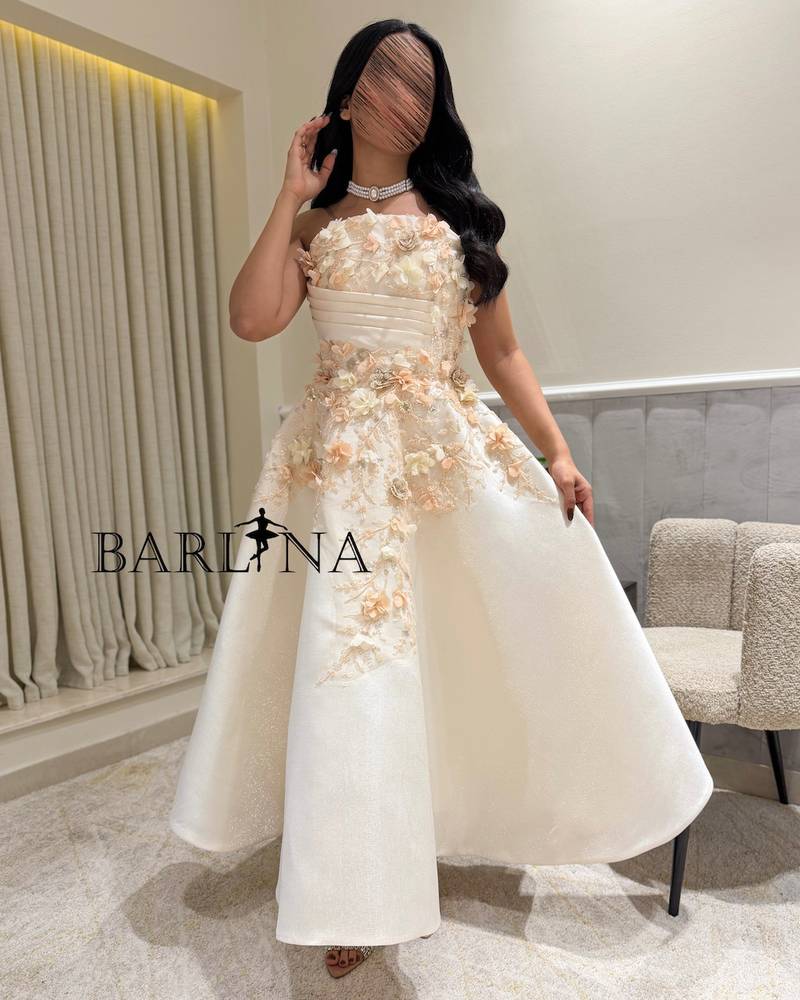White dress with pink touches and soft flowers