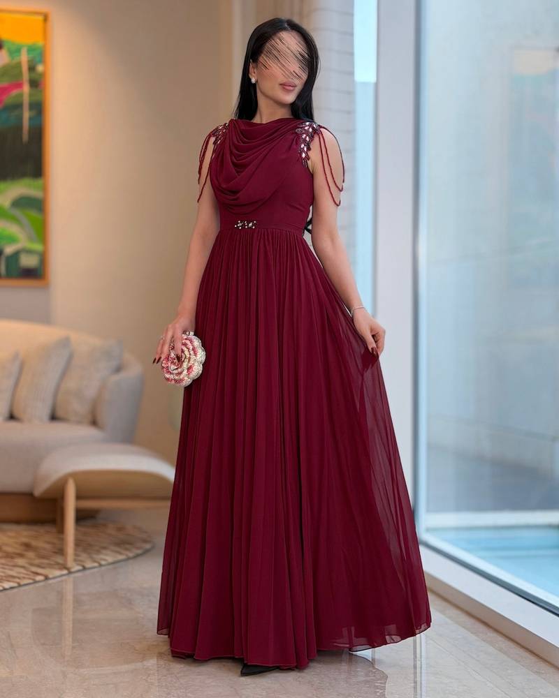 Long burgundy pleated dress with a draped collar