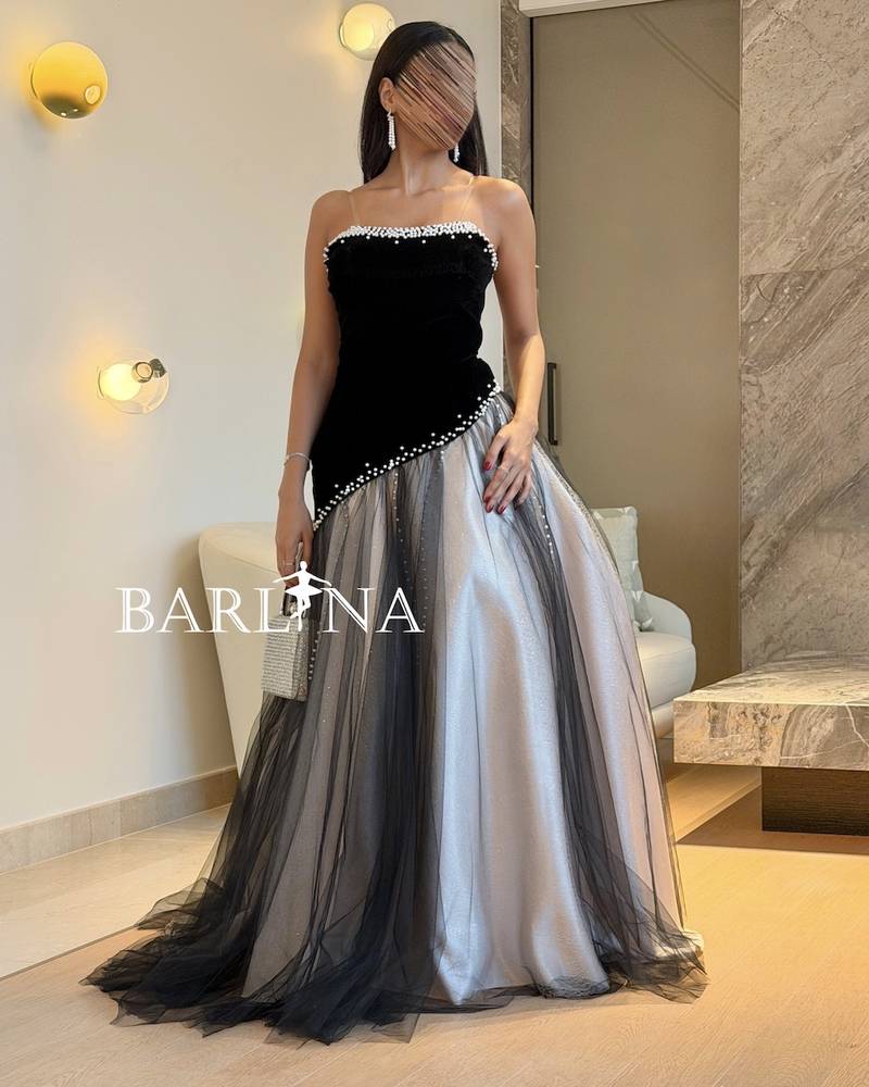 A black and silver dress with delicate pearl embroidery