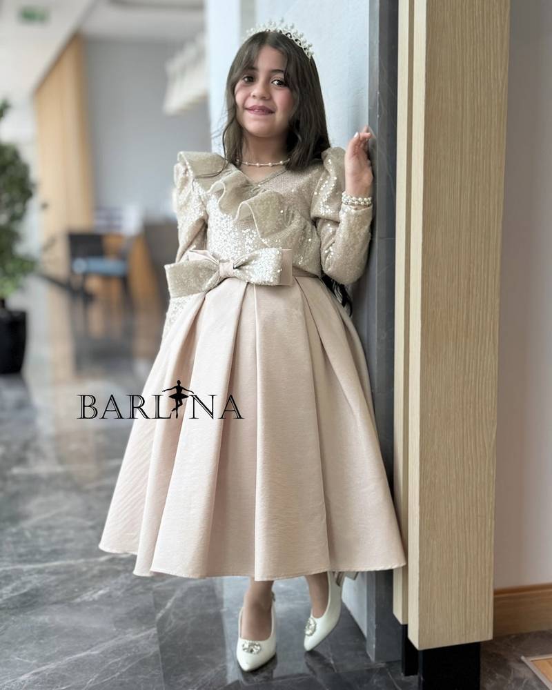 Beige girls' dress with a soft sequined sheen