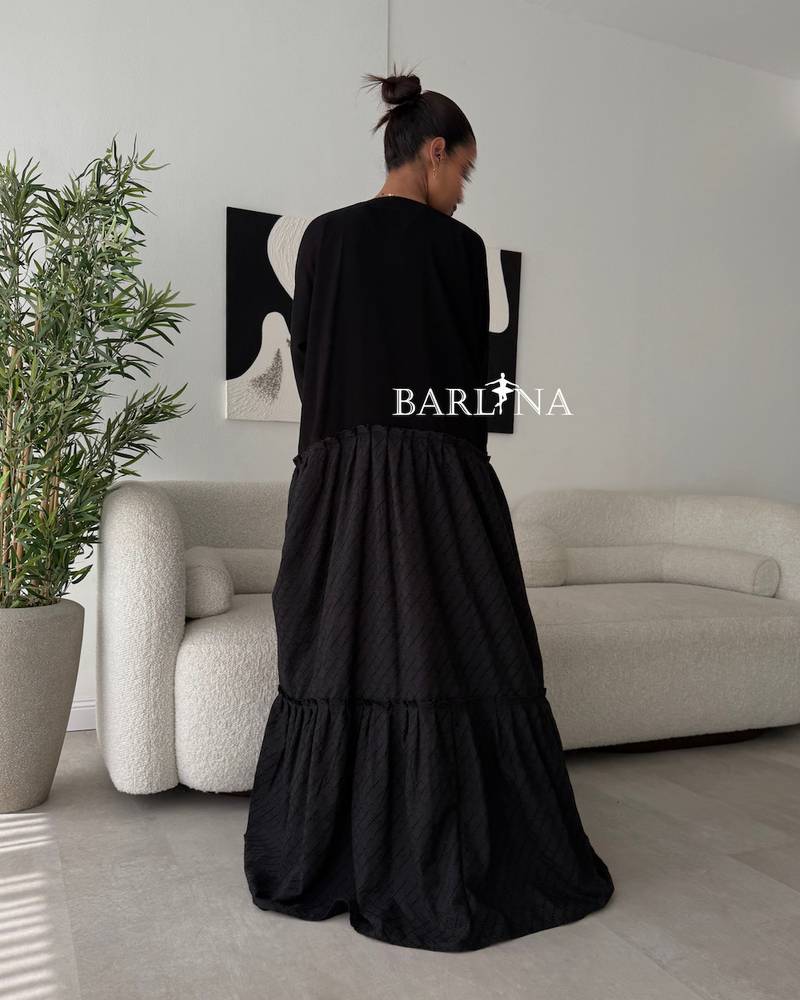 Elegant black abaya with patterned fabric