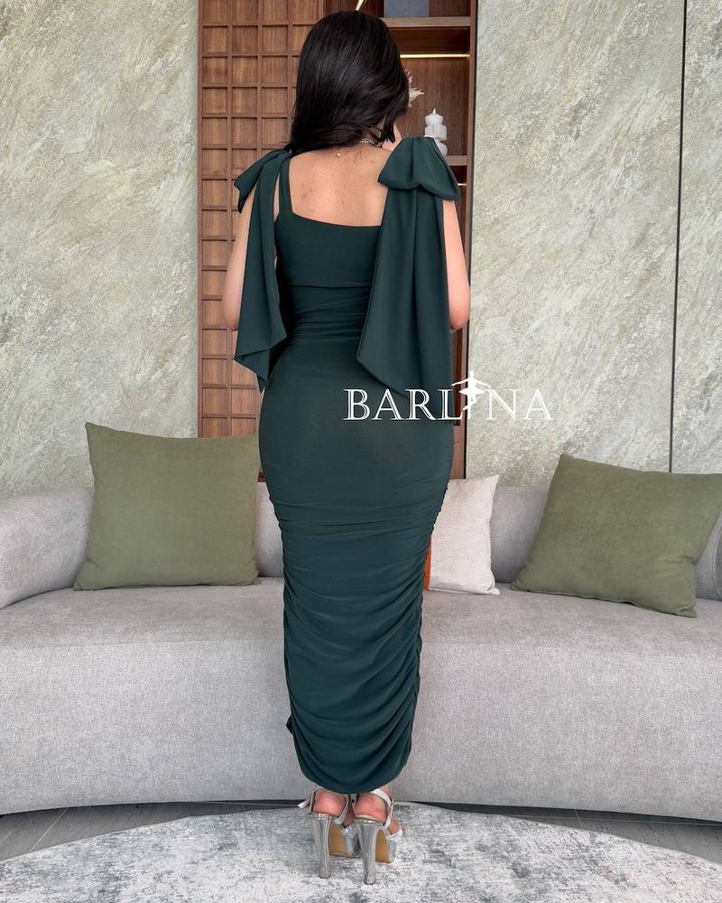 Dark green dress with bow on the shoulders