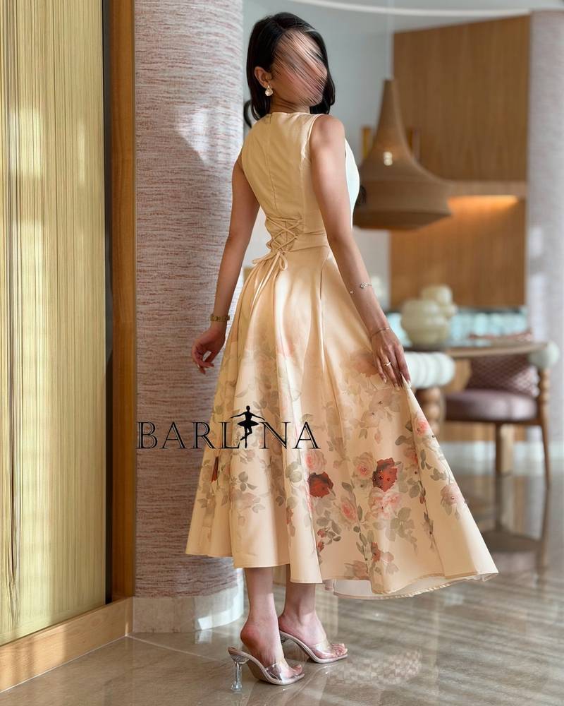 Beige dress adorned with delicate floral prints