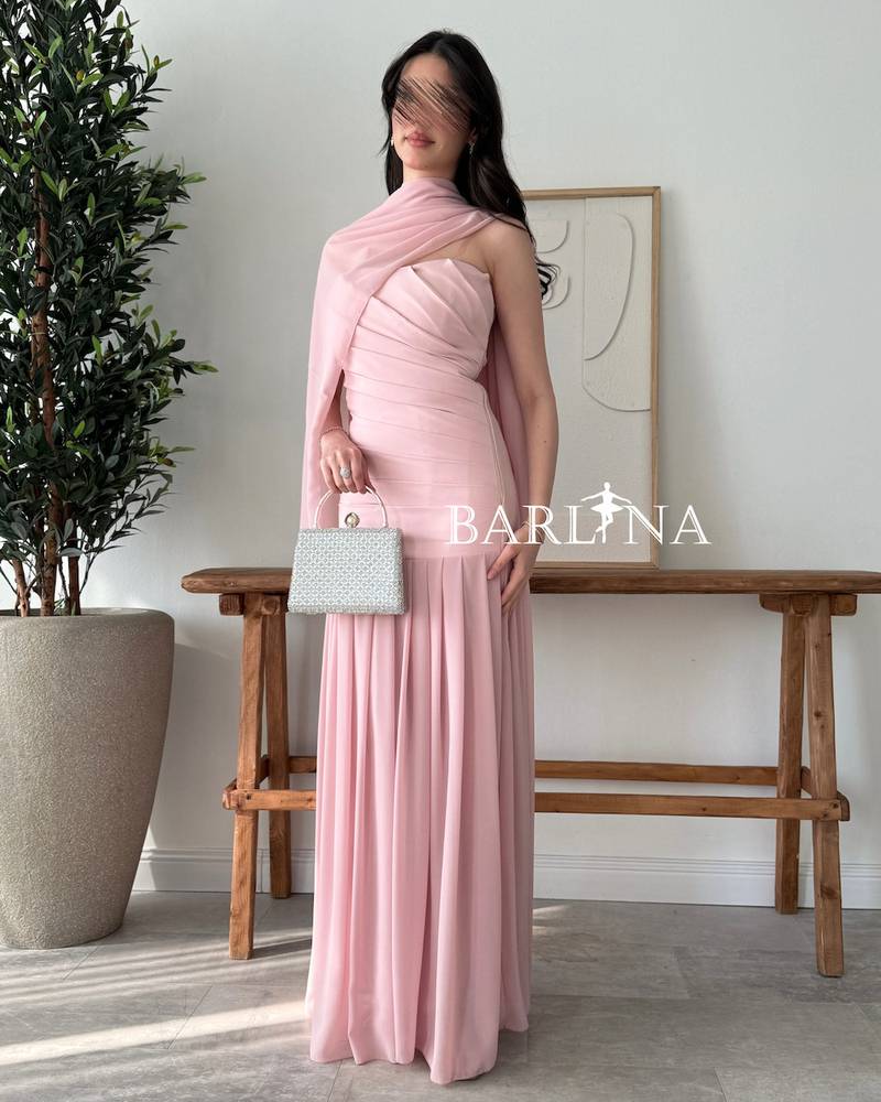 A soft pink dress with a matching shawl