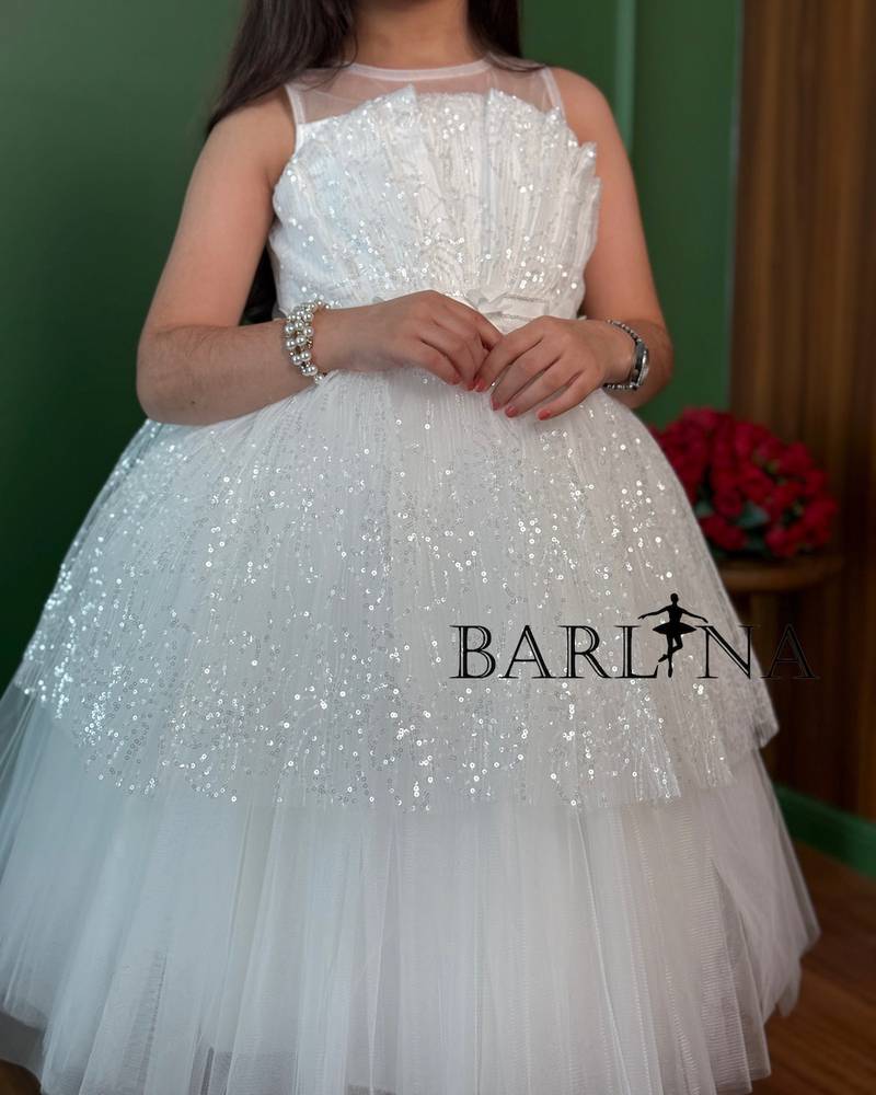 White girls' dress with tulle layers and a touch of sparkle