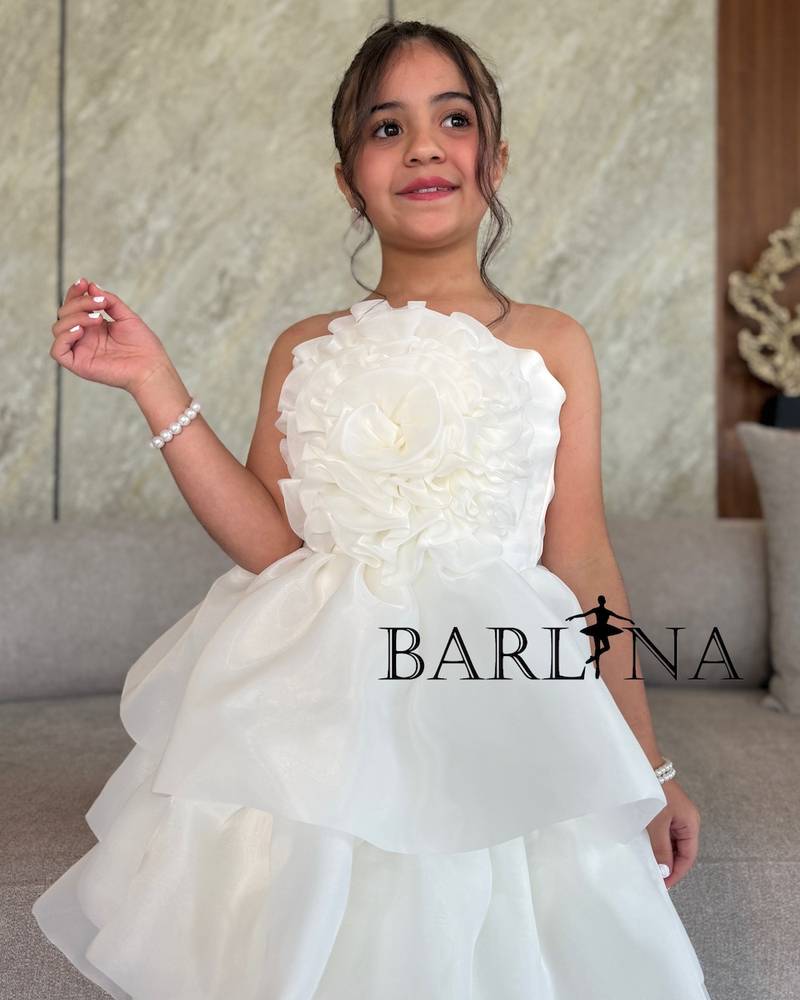 Off-white girls' dress with a large flower on the chest