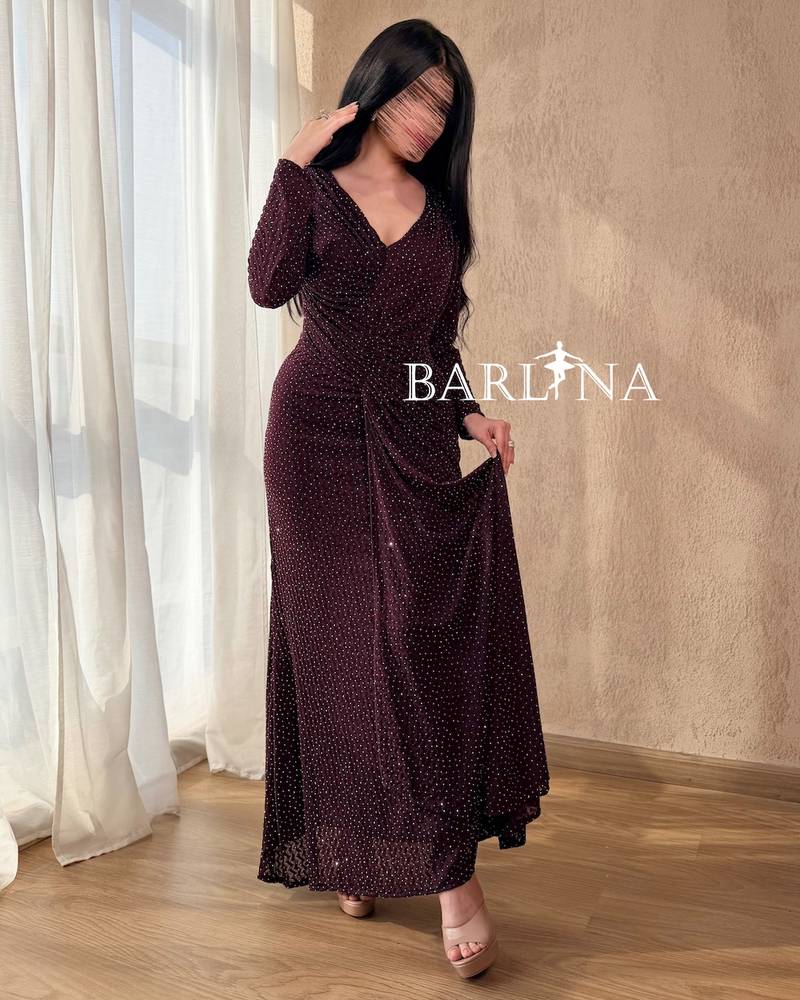 A dark burgundy dress studded with small sequins