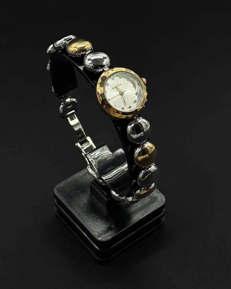An elegant wristwatch with an oval gemstone design