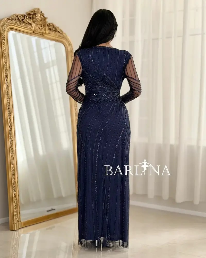Elegant evening dress adorned with shimmering embroidery lines