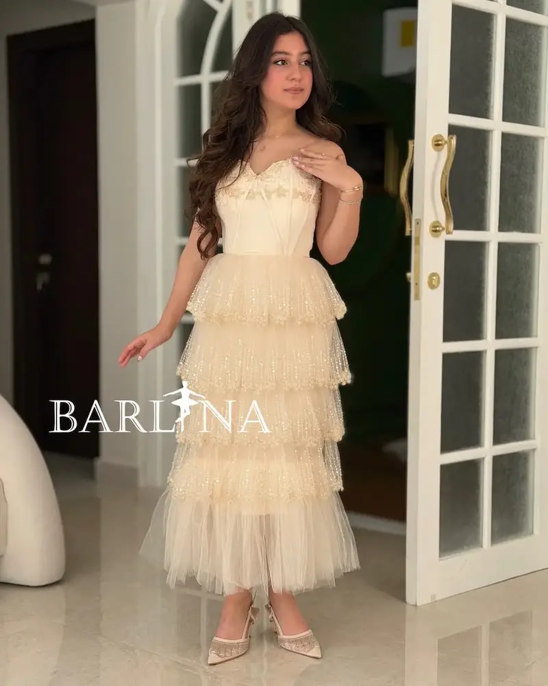 Creamy dress with layers of shimmering tulle