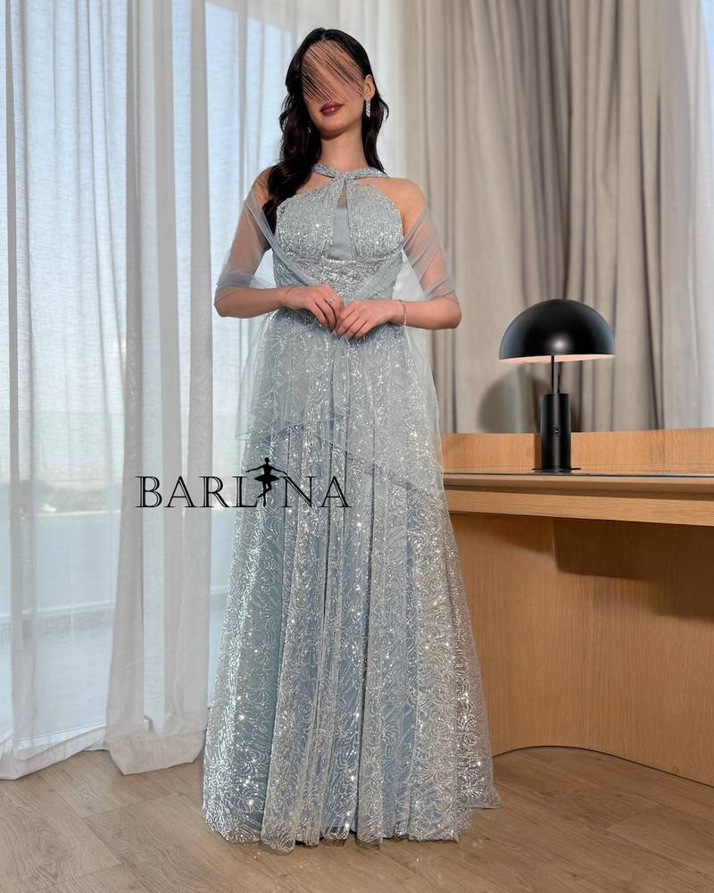 A sparkling sky blue halter dress with a plunging neckline