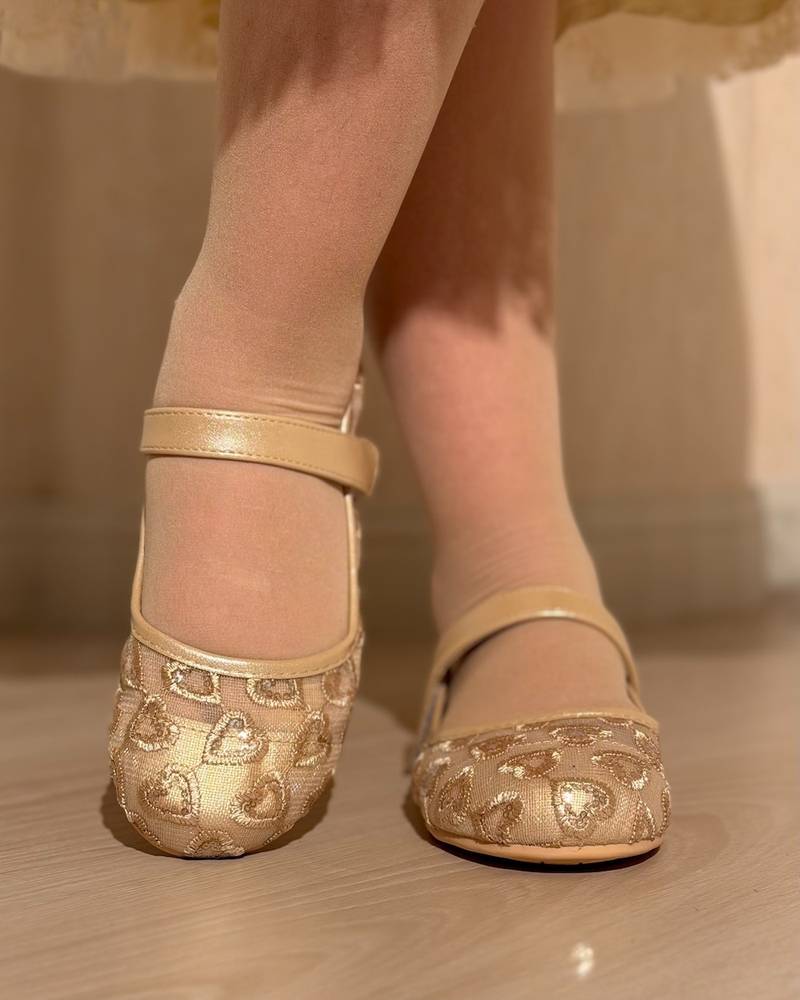 Girls' transparent shoes with an elegant heart design