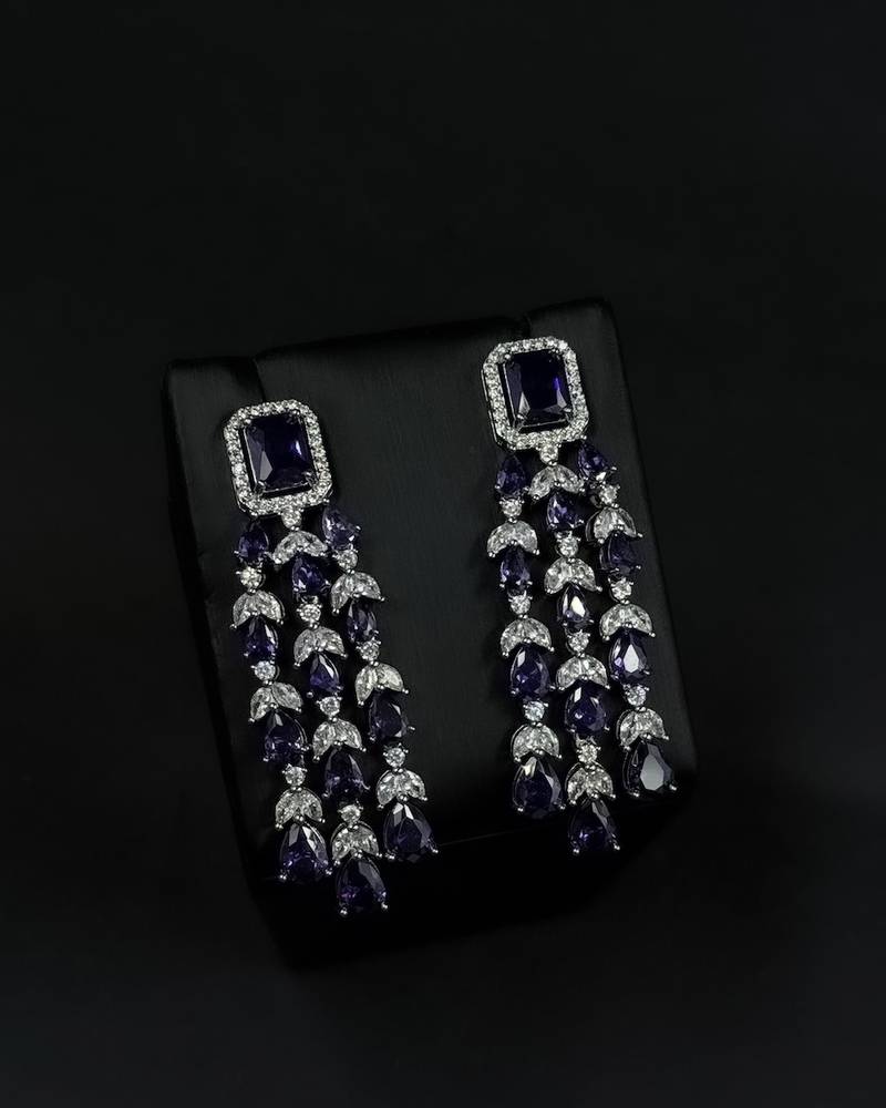 Elegant navy blue accessory set with dangling details