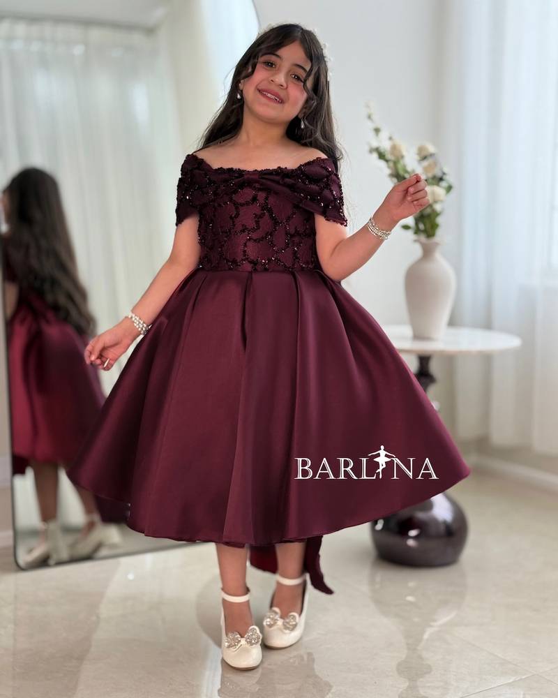 Girls' burgundy evening dress with a wide cut