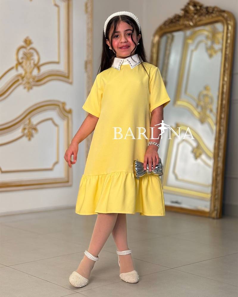 Soft yellow girls' dress with a white collar