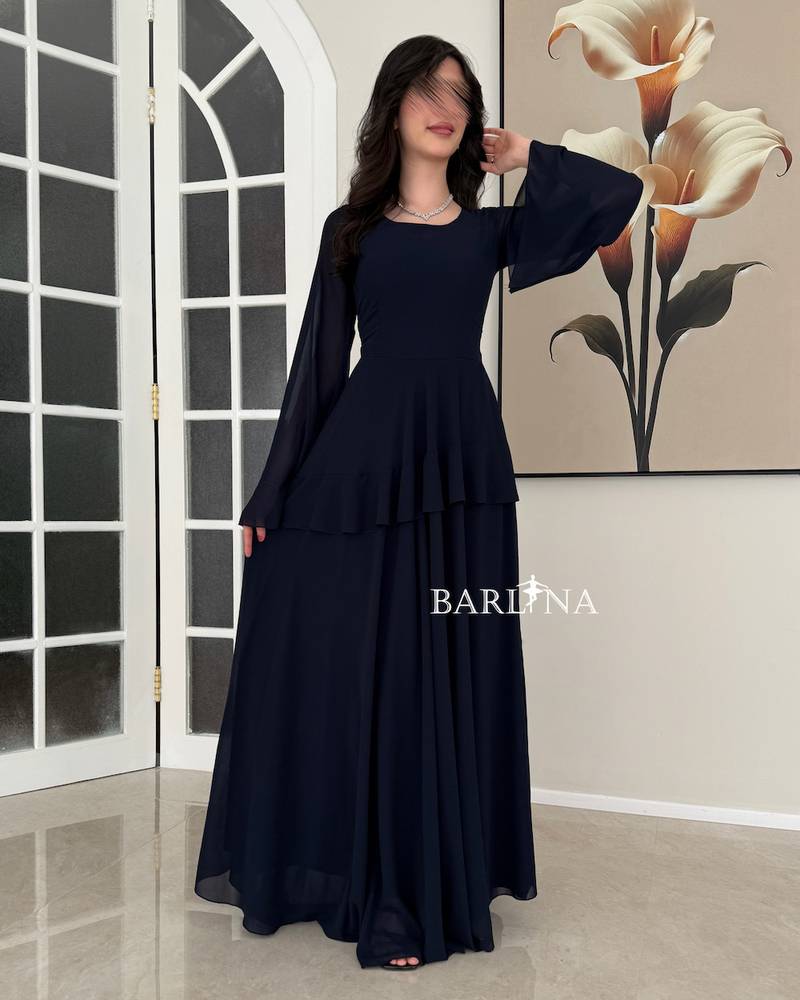 Elegant navy blue dress with a flowing silhouette and wide sleeves