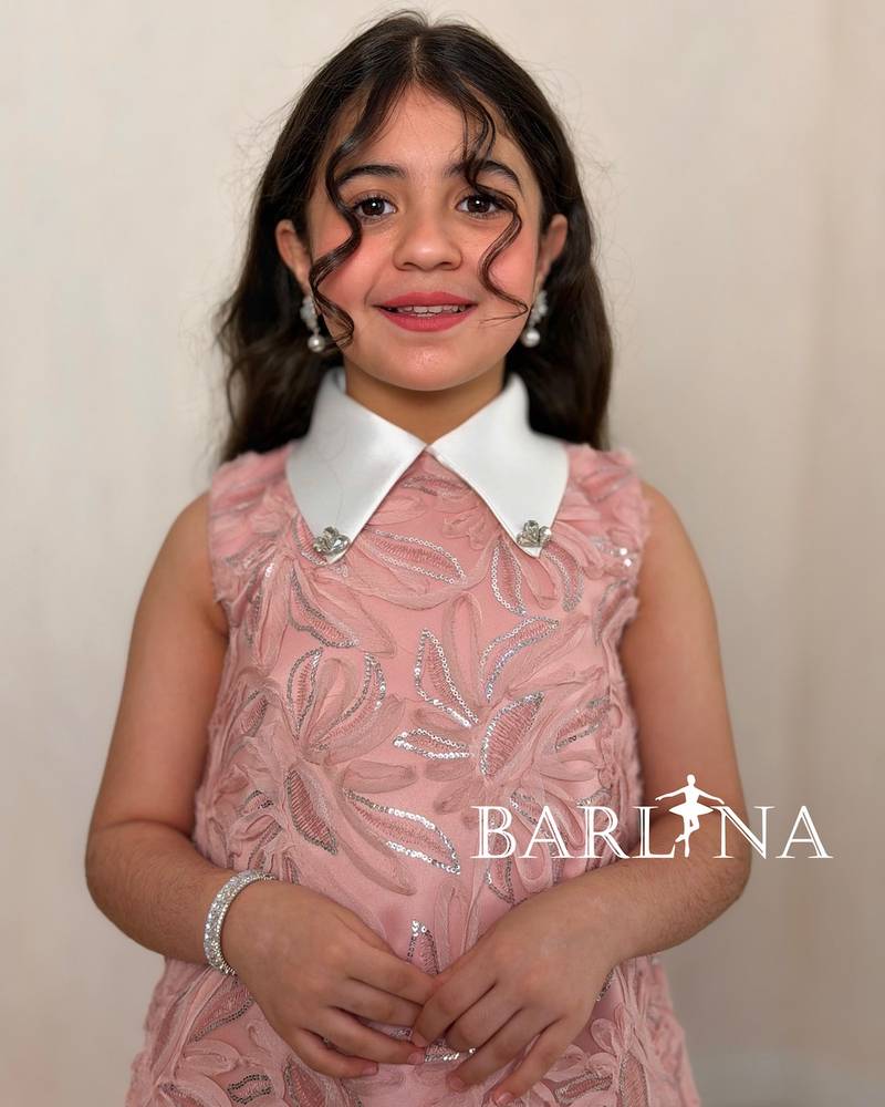Soft pink girl's dress with a white collar