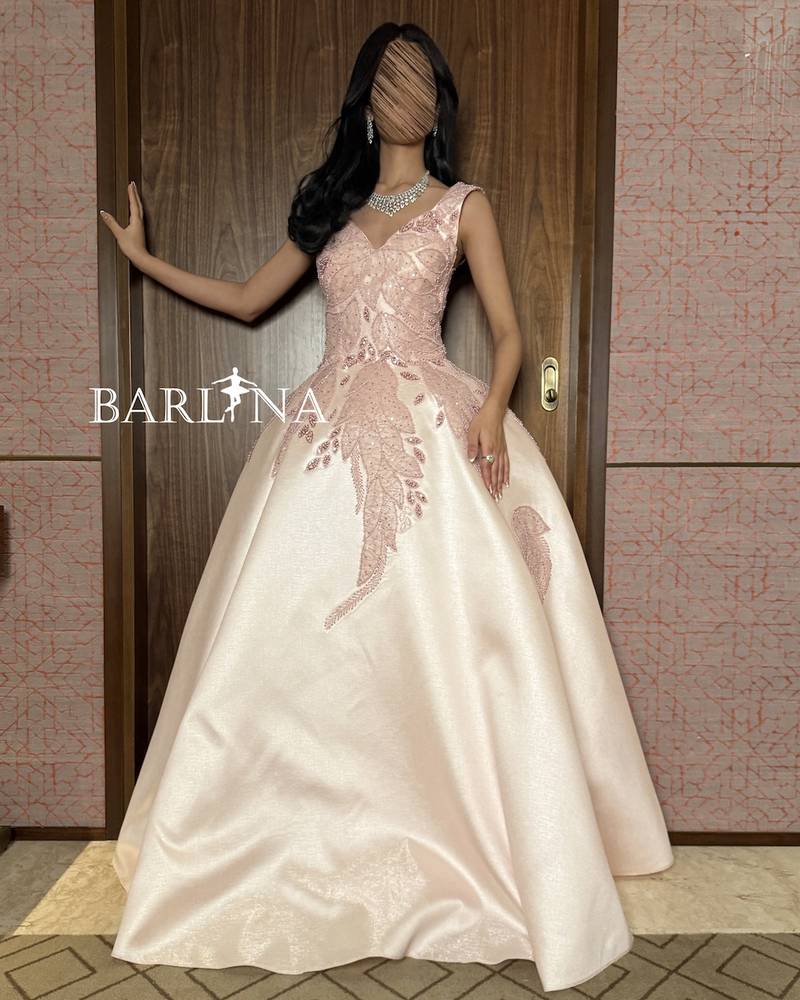 Light pink dress with floral leaf embroidery