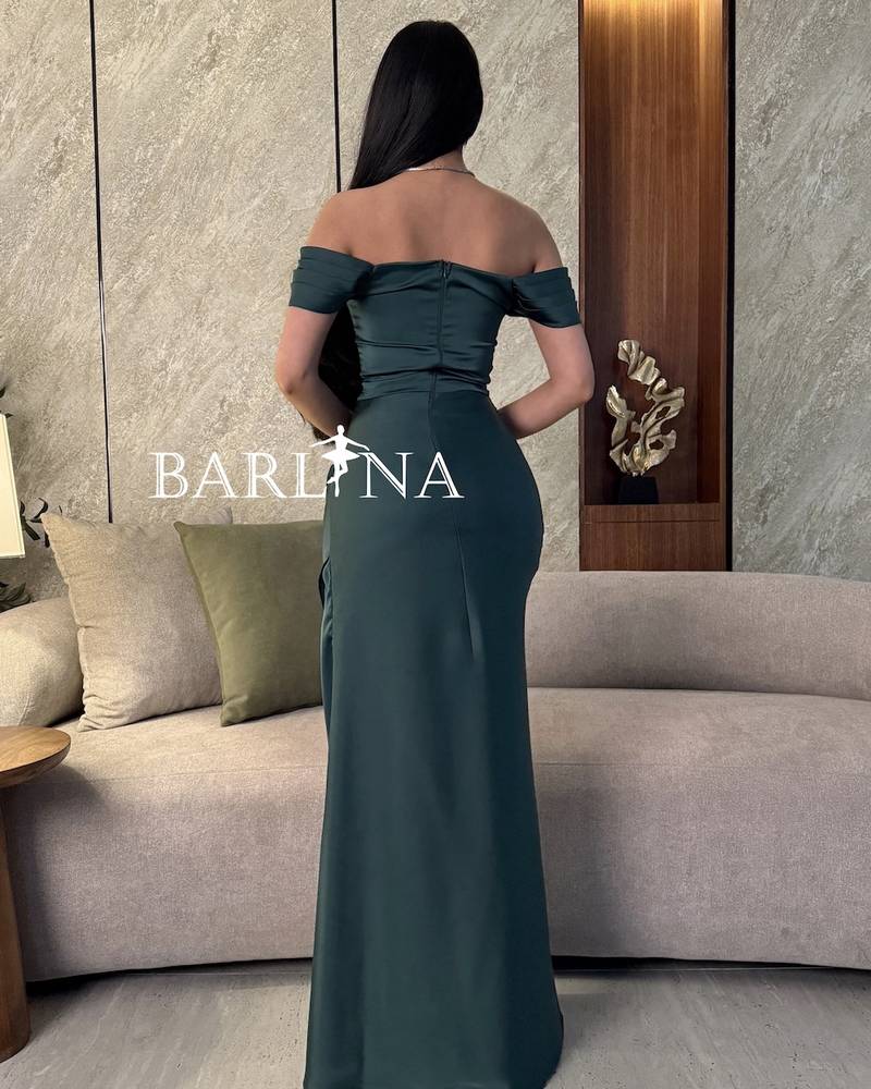 Green evening dress with corset design and front slit